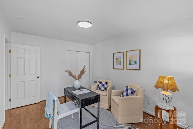 office area with baseboards, ornamental molding, and wood finished floors