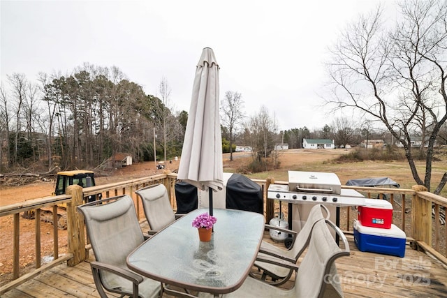 deck with outdoor dining area