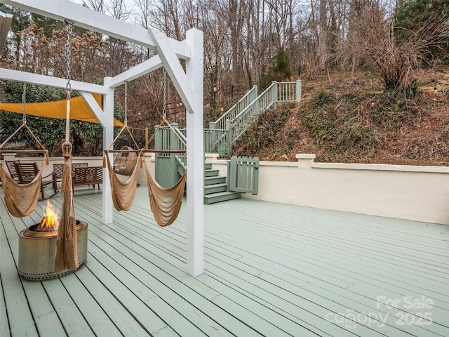 wooden deck featuring stairs