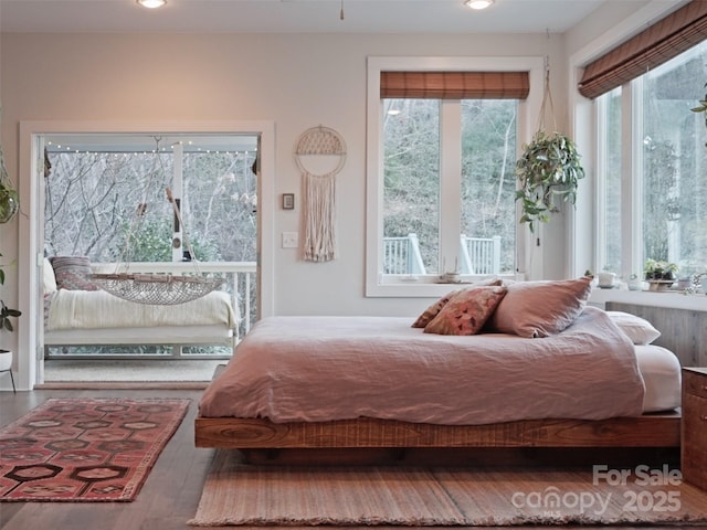 bedroom featuring wood finished floors and recessed lighting