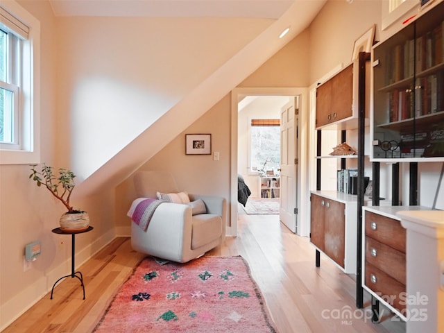 sitting room featuring light wood-type flooring and baseboards