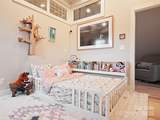 bedroom featuring wood finished floors