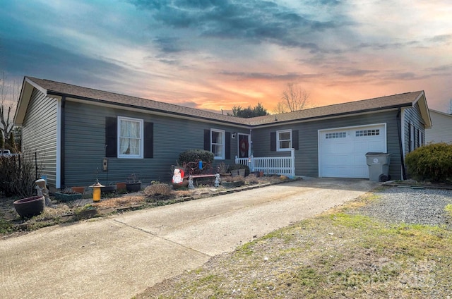 single story home featuring an attached garage and concrete driveway