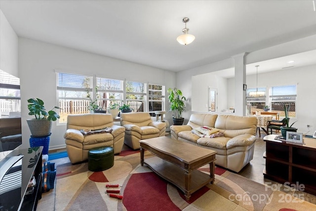 living area with decorative columns