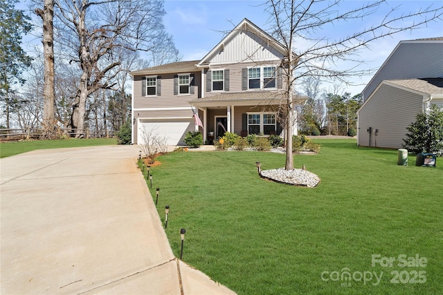 view of front of property with a garage, driveway, board and batten siding, covered porch, and a front yard
