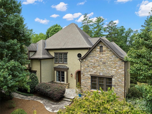 view of front of house featuring stucco siding