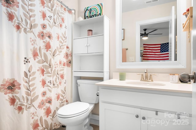 full bathroom featuring toilet, curtained shower, visible vents, and vanity