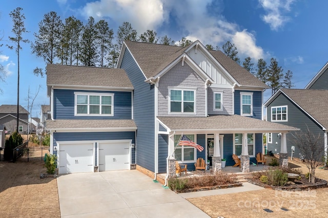 craftsman house with a porch, a shingled roof, concrete driveway, board and batten siding, and a garage