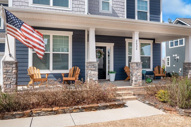 doorway to property with a porch