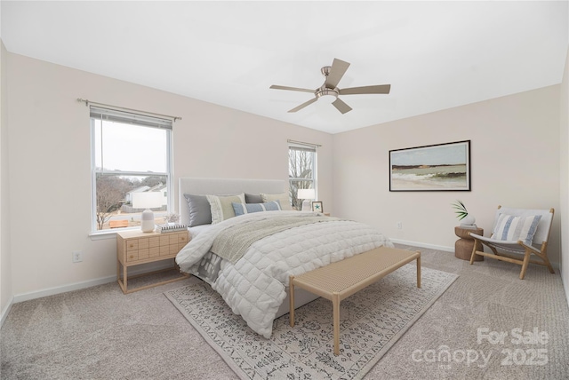 carpeted bedroom featuring ceiling fan and baseboards