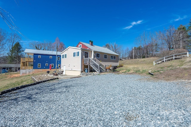 view of front of house featuring a chimney