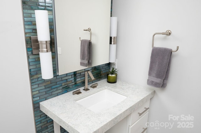 bathroom featuring decorative backsplash and vanity