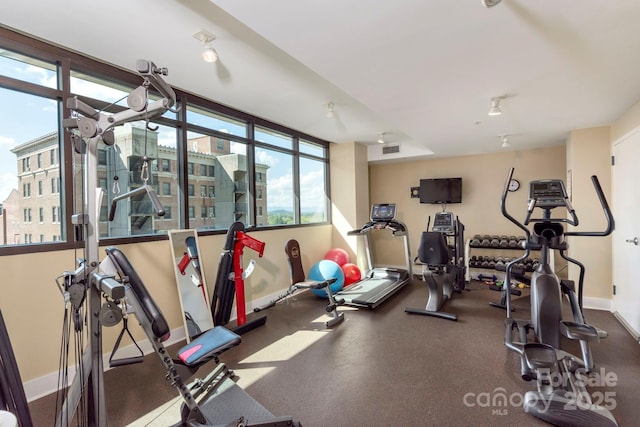 workout area with visible vents and baseboards