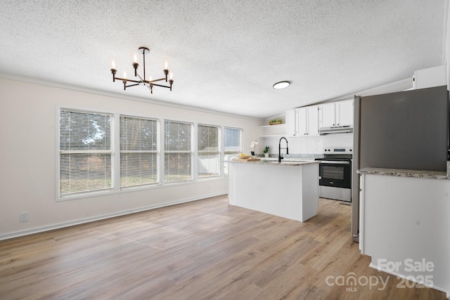 kitchen with light wood-style flooring, under cabinet range hood, white cabinets, vaulted ceiling, and stainless steel electric range