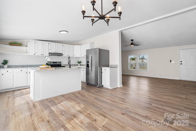 kitchen with light wood-style flooring, under cabinet range hood, white cabinetry, appliances with stainless steel finishes, and open shelves