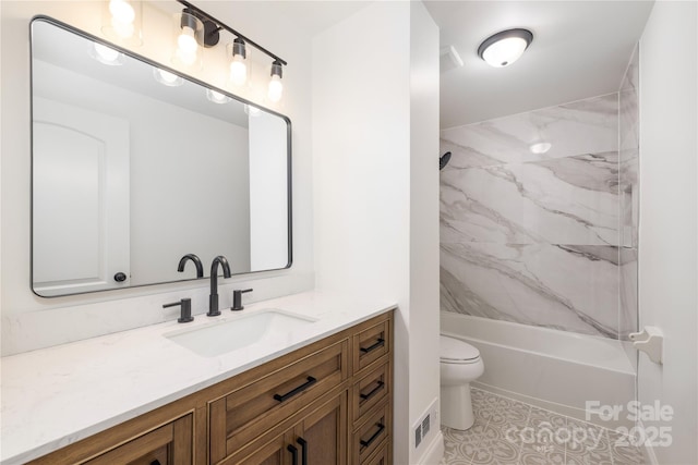 full bathroom featuring toilet, tile patterned floors,  shower combination, and vanity