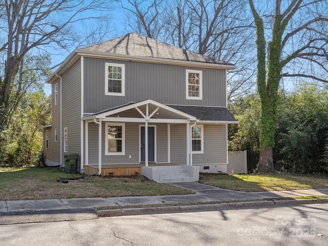 view of front facade with a porch, crawl space, and roof with shingles