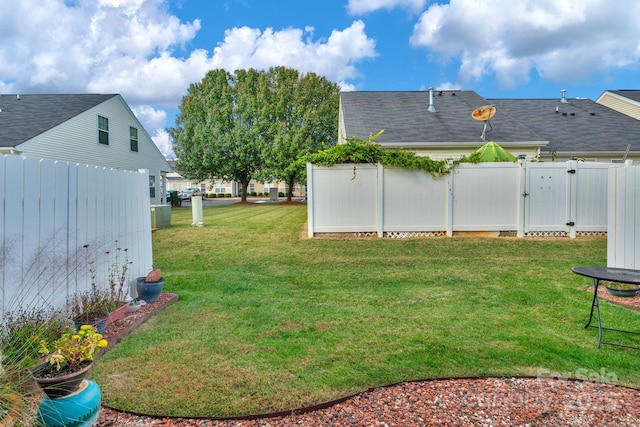 view of yard with a gate and fence