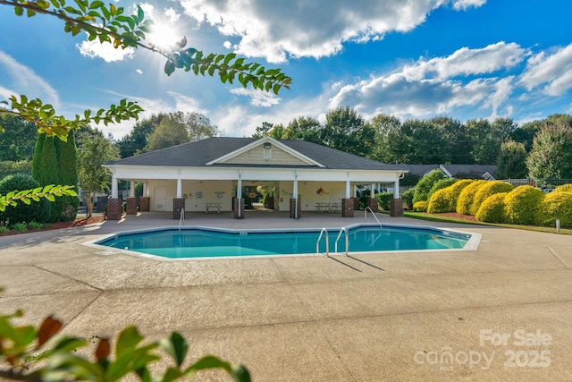 view of pool featuring a fenced in pool, a patio area, and fence