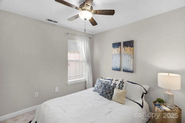 carpeted bedroom with baseboards, visible vents, and ceiling fan