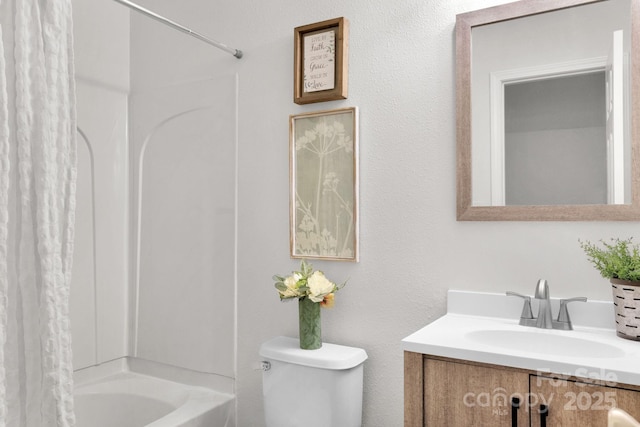 bathroom featuring shower / bath combination with curtain, vanity, and toilet