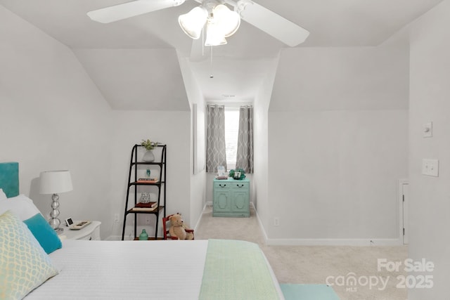 carpeted bedroom featuring lofted ceiling, a ceiling fan, and baseboards