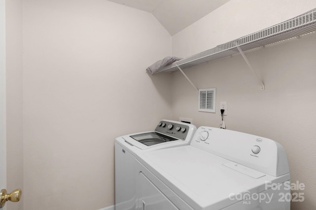 clothes washing area featuring laundry area, independent washer and dryer, and visible vents