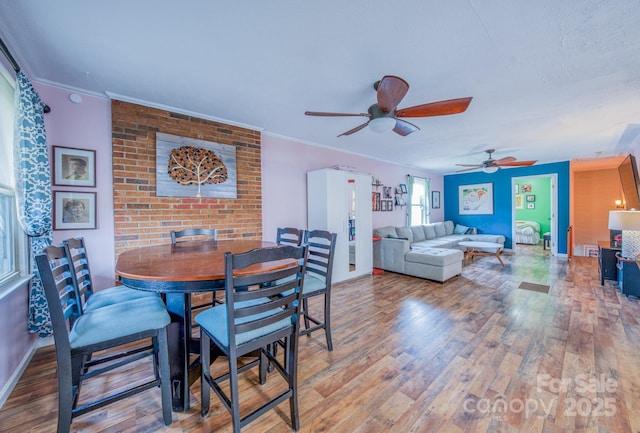 91 Congress St, Asheville, NC 28801 - dining room with ornamental molding, ceiling fan, baseboards, and wood finished floors
