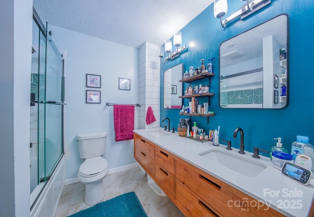 91 Congress St, Asheville, NC 28801 - bathroom with a textured ceiling, double vanity, a sink, and toilet