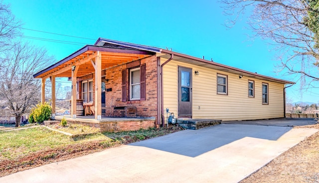 91 Congress St, Asheville, NC 28801 - view of front of home with a porch and brick siding