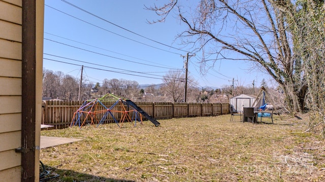 91 Congress St, Asheville, NC 28801 - view of yard with a fenced backyard, a shed, and an outbuilding