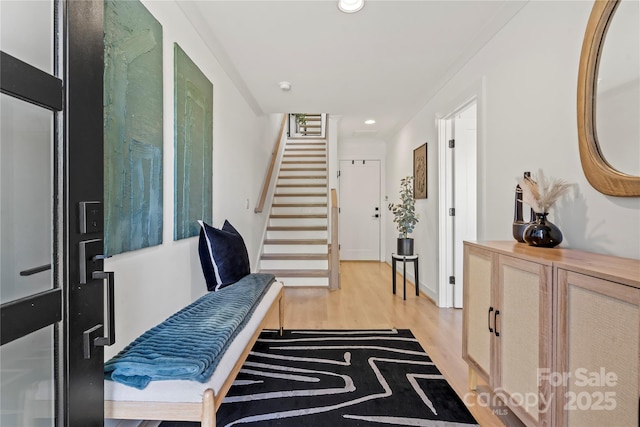 entrance foyer featuring stairway, recessed lighting, and light wood-style floors