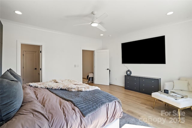 bedroom featuring ceiling fan, recessed lighting, crown molding, and wood finished floors