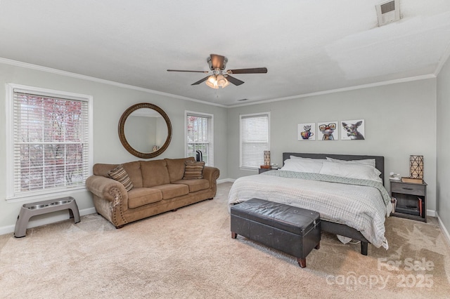 bedroom featuring carpet flooring, a ceiling fan, crown molding, and baseboards