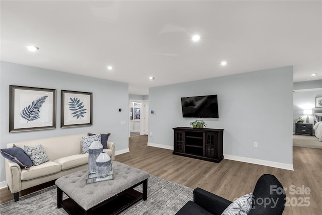 living room featuring wood finished floors and recessed lighting