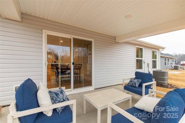 view of patio featuring an outdoor living space and central AC