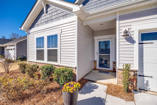 property entrance featuring a garage