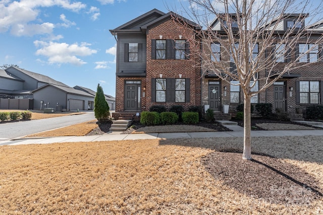 view of property with brick siding