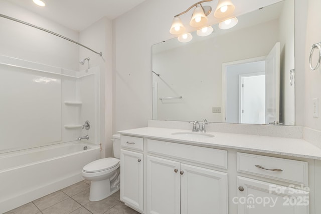 bathroom with tile patterned flooring, toilet, vanity, and bathing tub / shower combination