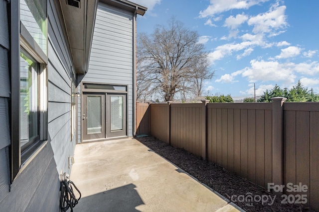 view of patio / terrace featuring french doors and a fenced backyard