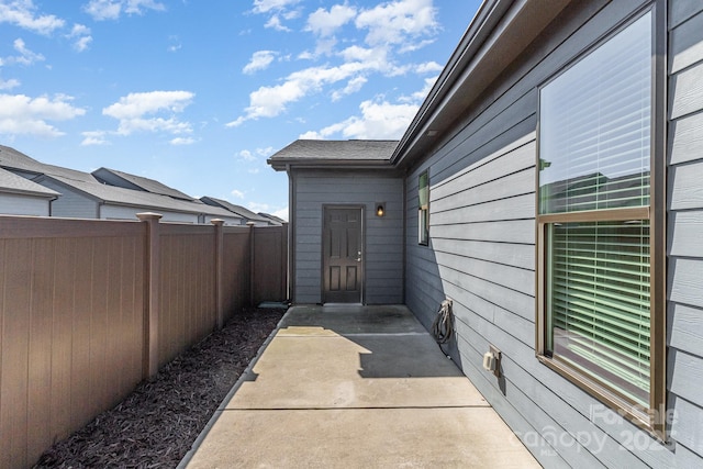 view of patio featuring fence