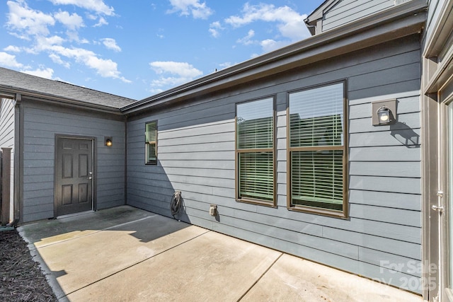 entrance to property with a patio