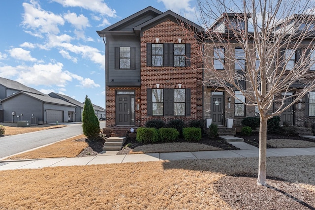 view of front of property with brick siding and central AC unit