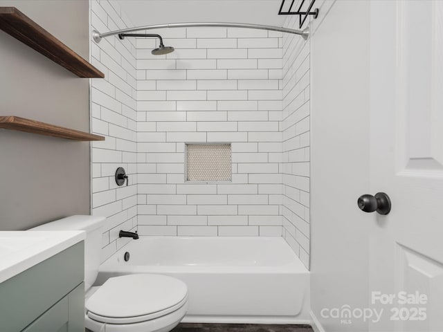 full bathroom with tub / shower combination, vanity, and toilet