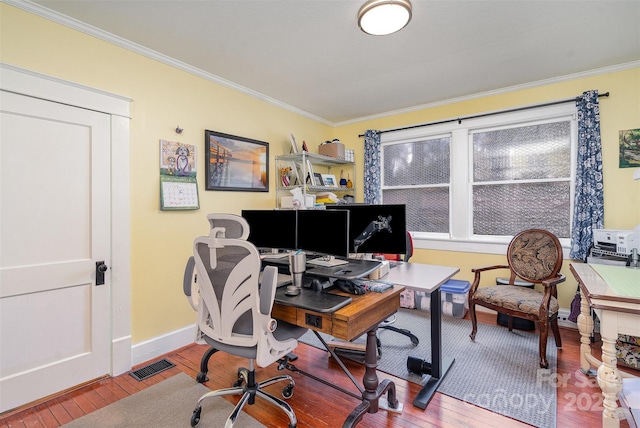 office area with crown molding, visible vents, baseboards, and hardwood / wood-style floors