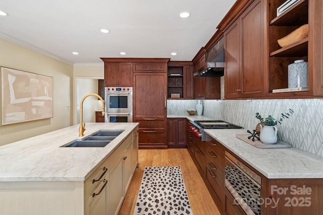 kitchen featuring open shelves, stainless steel appliances, a sink, light wood-type flooring, and exhaust hood