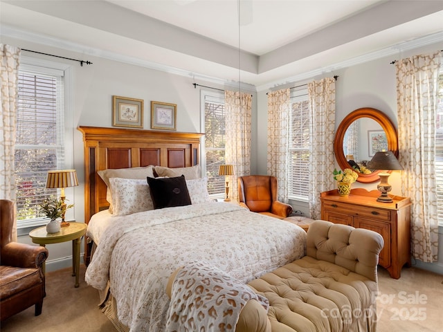 bedroom with light carpet, crown molding, and baseboards