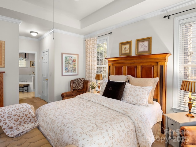 bedroom with ornamental molding, a closet, and a raised ceiling