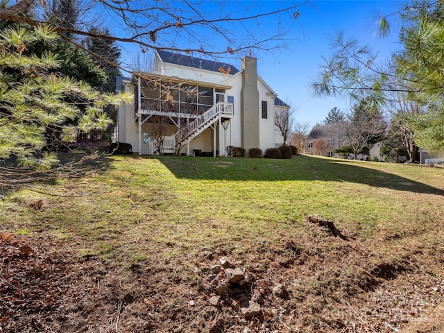 exterior space with a sunroom and stairway