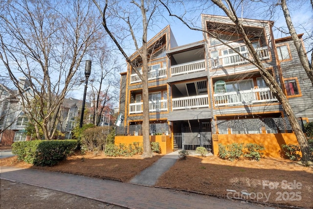 view of building exterior with a fenced front yard